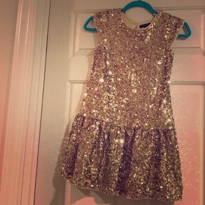 Girls gold sequin party dress.